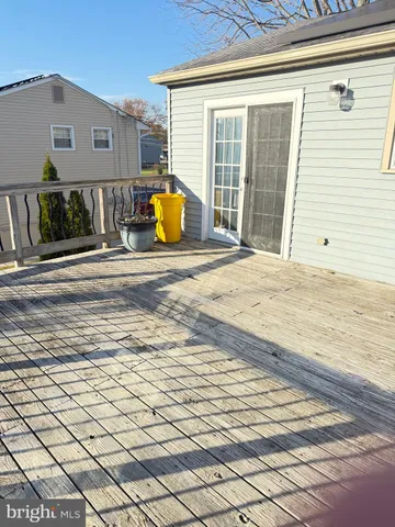 a view of patio with swimming pool and sitting area