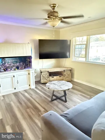 a living room with a couch and a flat screen tv