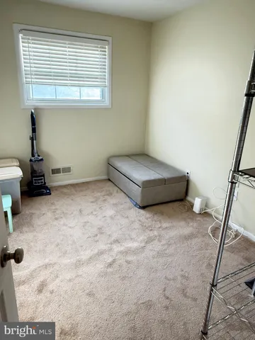 a room with a wooden floor and a chair