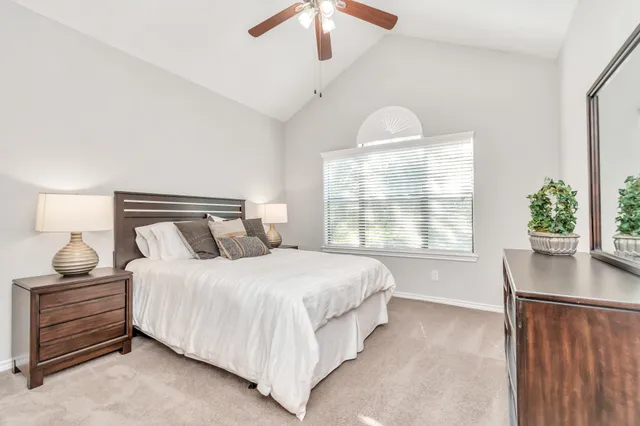 a bedroom with a bed and window
