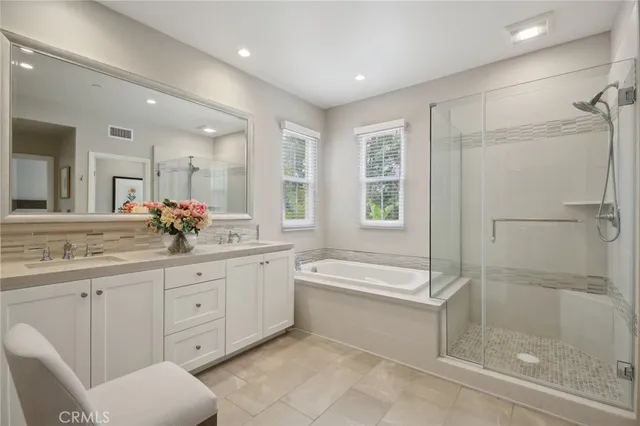 a bathroom with a granite countertop sink a toilet and shower