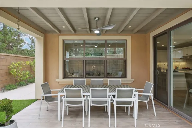 a dining area with a large window and chairs