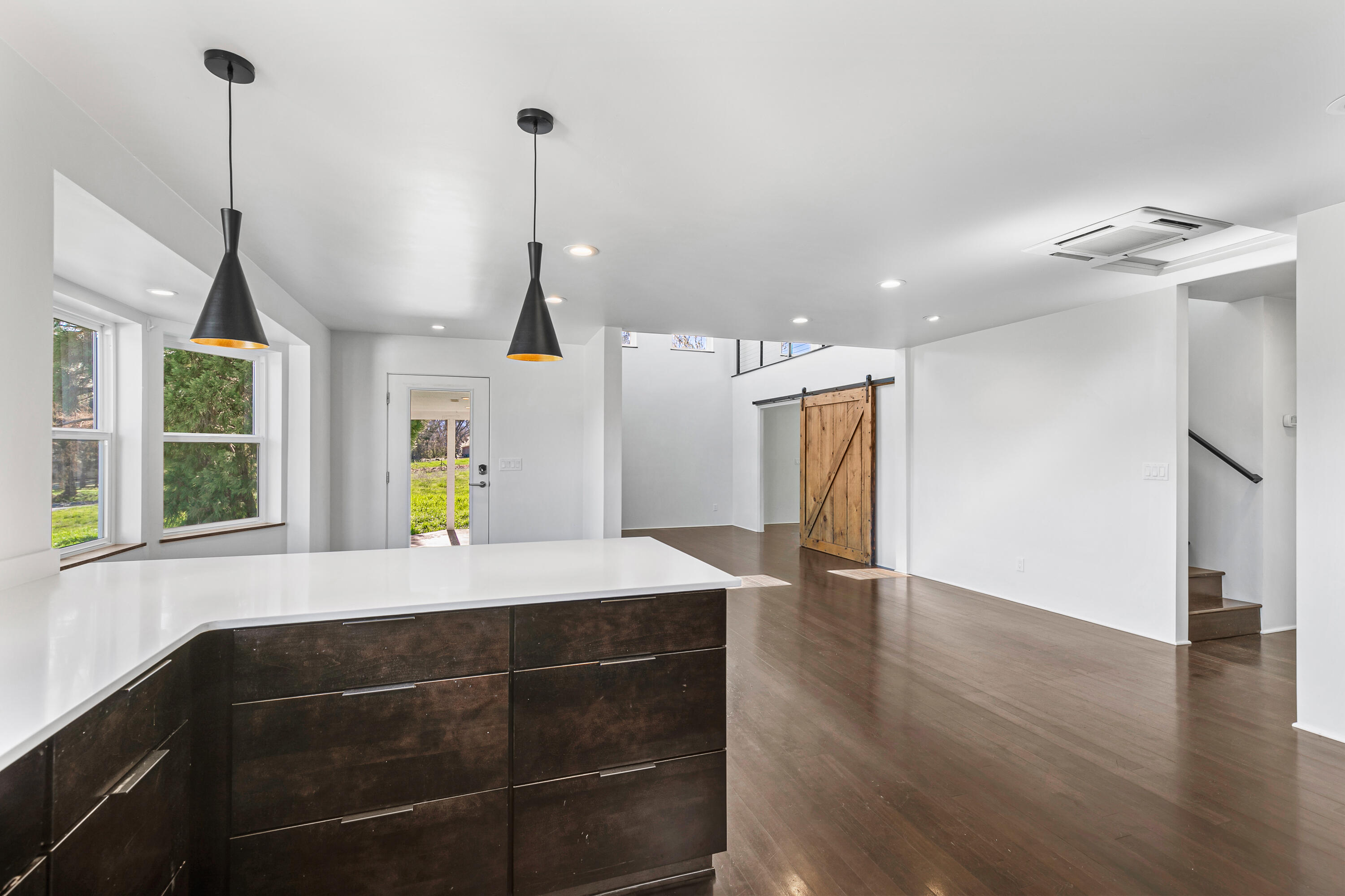 593 Crowson Road Ashland, OR 97520 - Photo 10 of 36 a view of a room with wooden floor and window