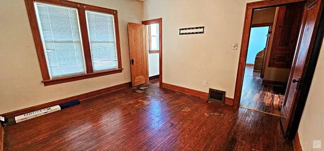 a room with wooden floor and chair