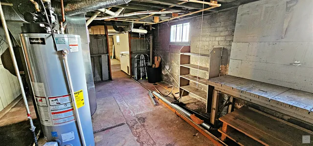 a view of a porch with a table and chairs