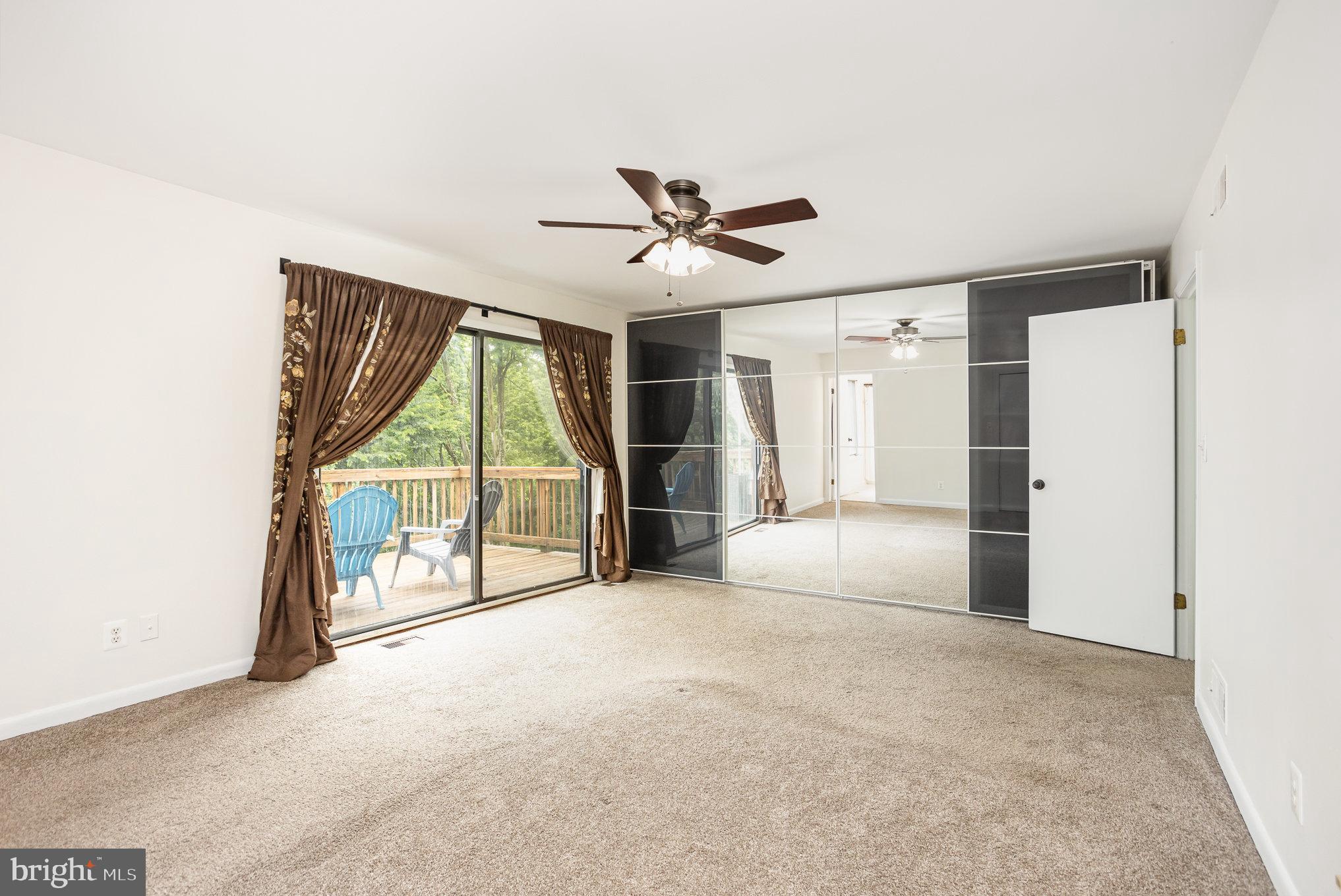 2007 Wilson Road White Hall, MD 21161 - Photo 21 of 41 an empty room with chandelier fan and windows