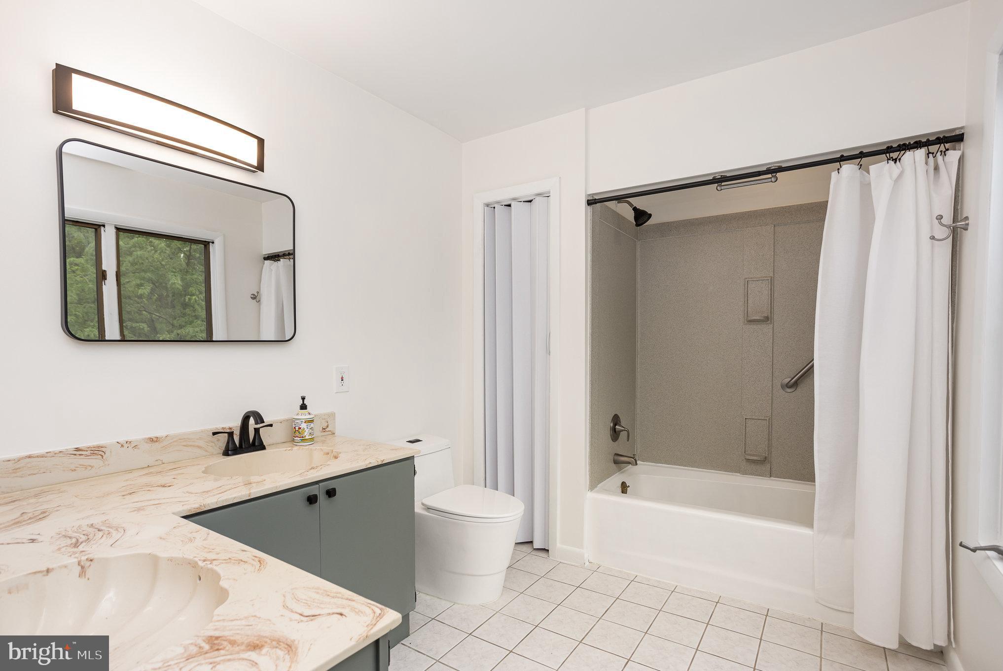 2007 Wilson Road White Hall, MD 21161 - Photo 22 of 41 a bathroom with a tub a sink and a mirror