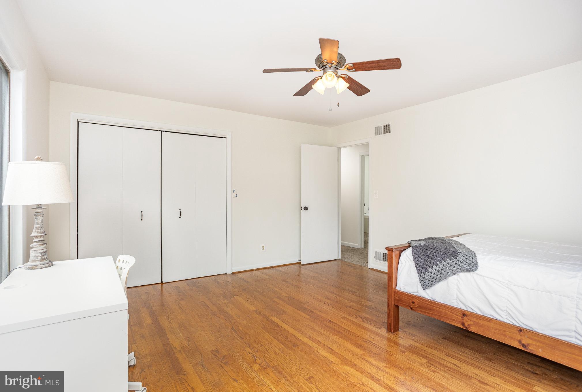 2007 Wilson Road White Hall, MD 21161 - Photo 24 of 41 a living room with a bed furniture and a ceiling fan