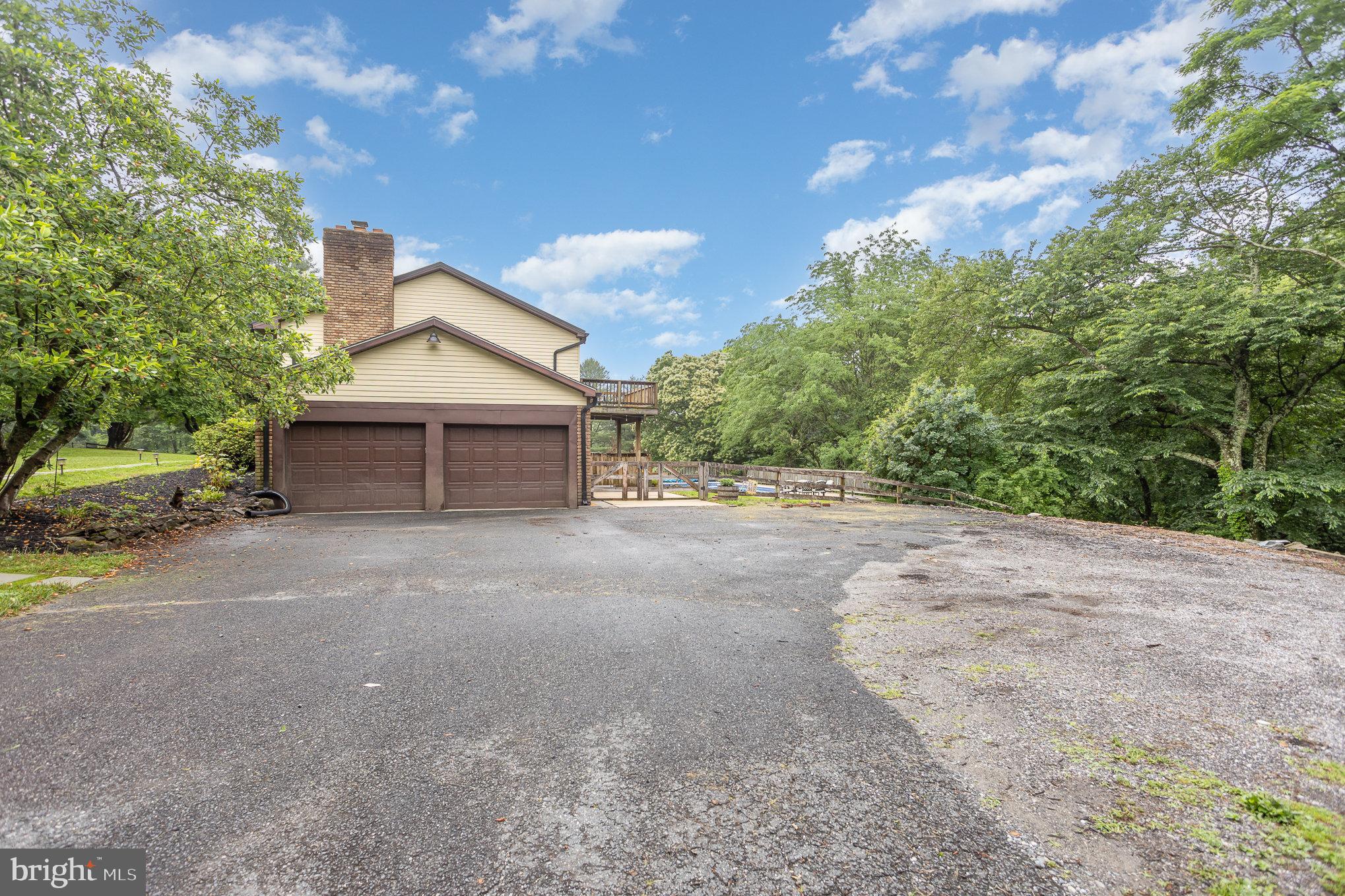 2007 Wilson Road White Hall, MD 21161 - Photo 4 of 41 a view of a house with a yard and garage