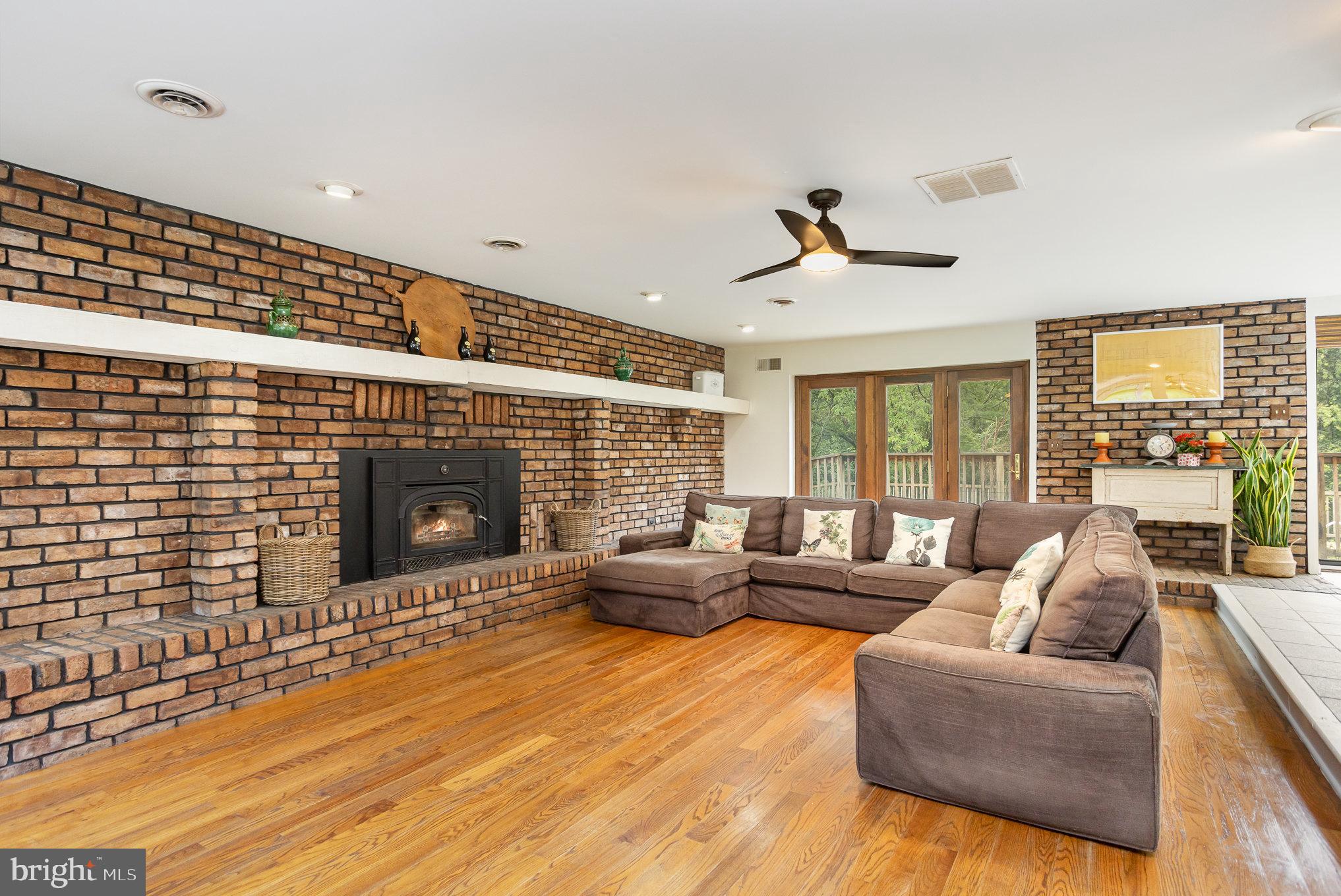 2007 Wilson Road White Hall, MD 21161 - Photo 7 of 41 a living room with furniture wooden floor and a fireplace
