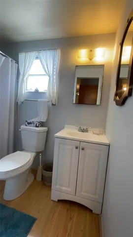 a bathroom with a toilet a sink and a shower