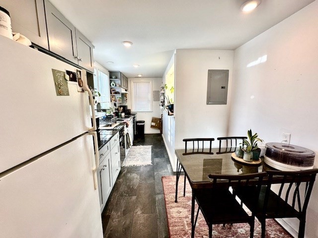 144 Robbins Street, Unit 4 Waltham, MA 02453 - Photo 2 of 8 a view of a dining room with furniture and wooden floor
