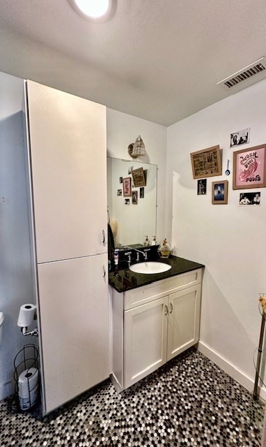144 Robbins Street, Unit 4 Waltham, MA 02453 - Photo 5 of 8 a kitchen with a refrigerator and a stove
