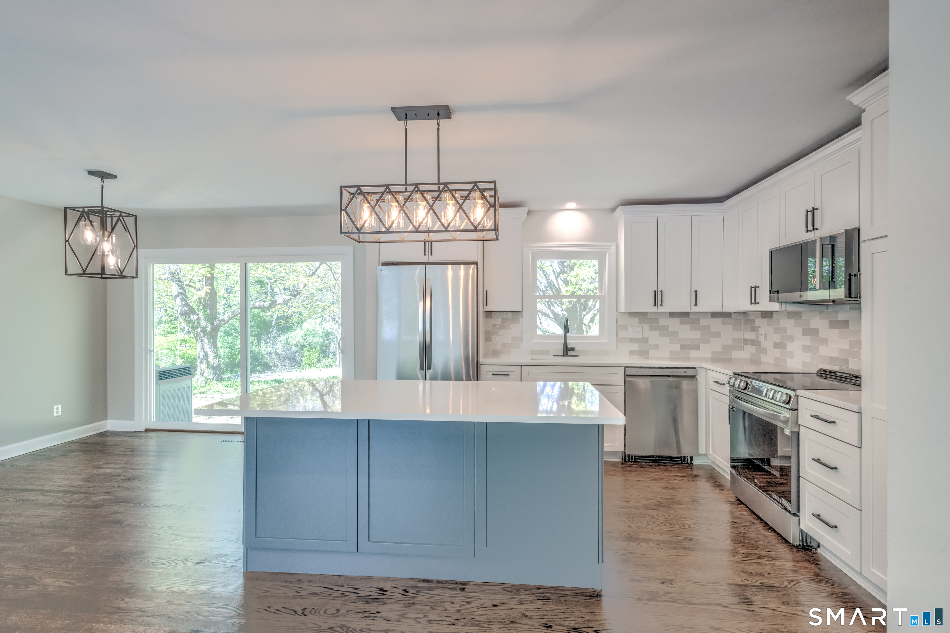 437 Middle Rd Turnpike Woodbury, CT 06798 - Photo 1 of 17 a view of a kitchen with granite countertop stainless steel appliances and wooden floor