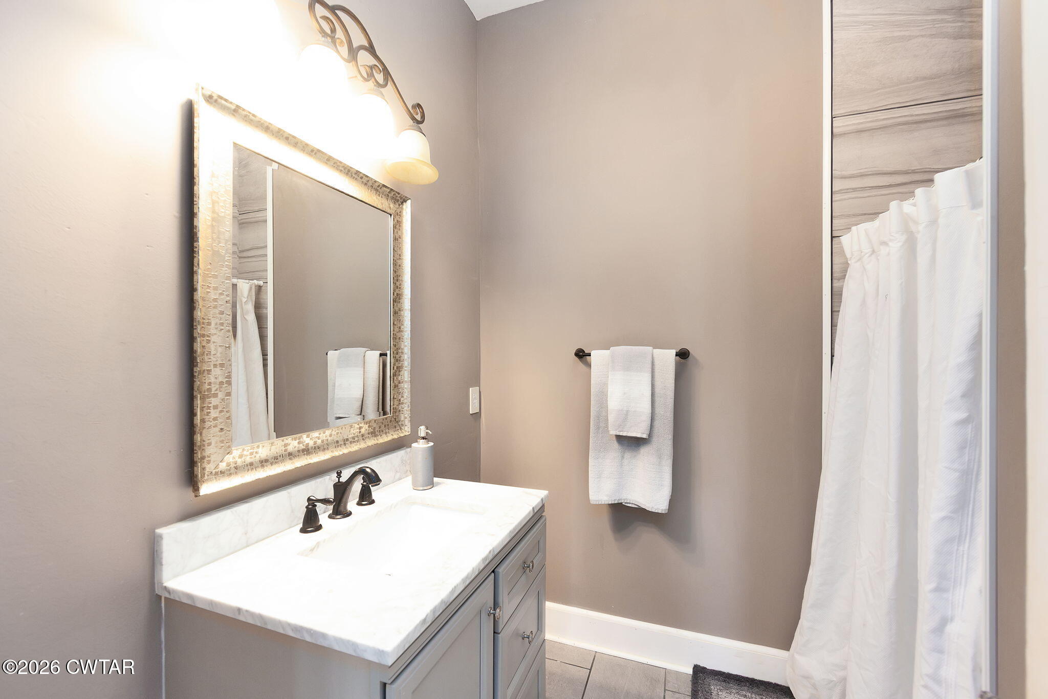 554 East Main Street Jackson, TN 38301 - Photo 36 of 60 a bathroom with a sink vanity and mirror