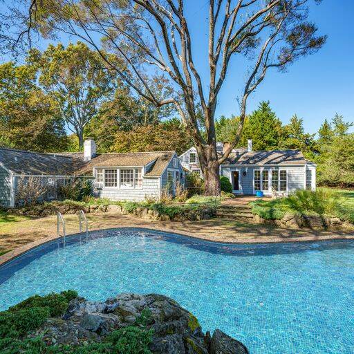 10 Ferry Road Sag Harbor, NY 11963 - Photo 12 of 41 a front view of a house with a yard