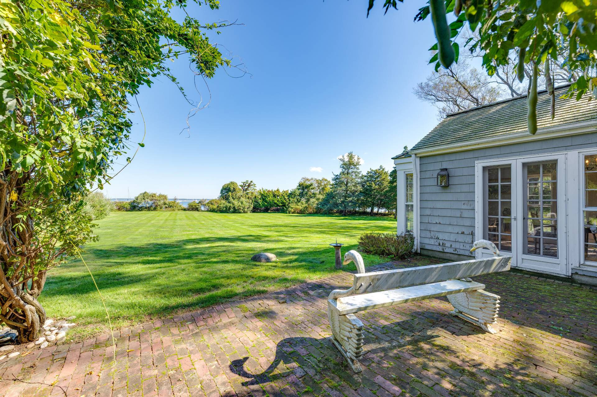 10 Ferry Road Sag Harbor, NY 11963 - Photo 16 of 41 a view of a house with backyard porch and garden