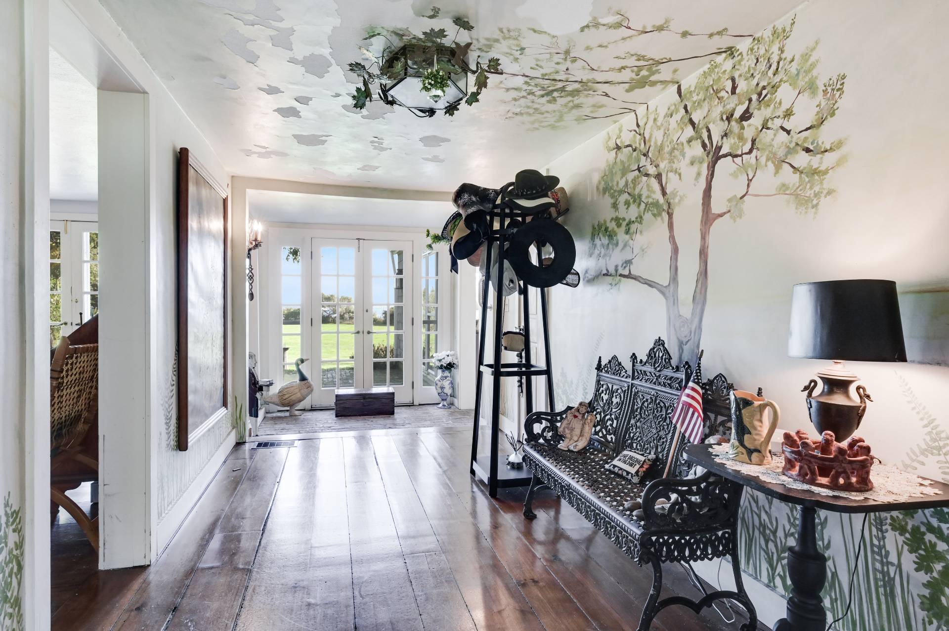 10 Ferry Road Sag Harbor, NY 11963 - Photo 21 of 41 a living room with furniture and a chandelier