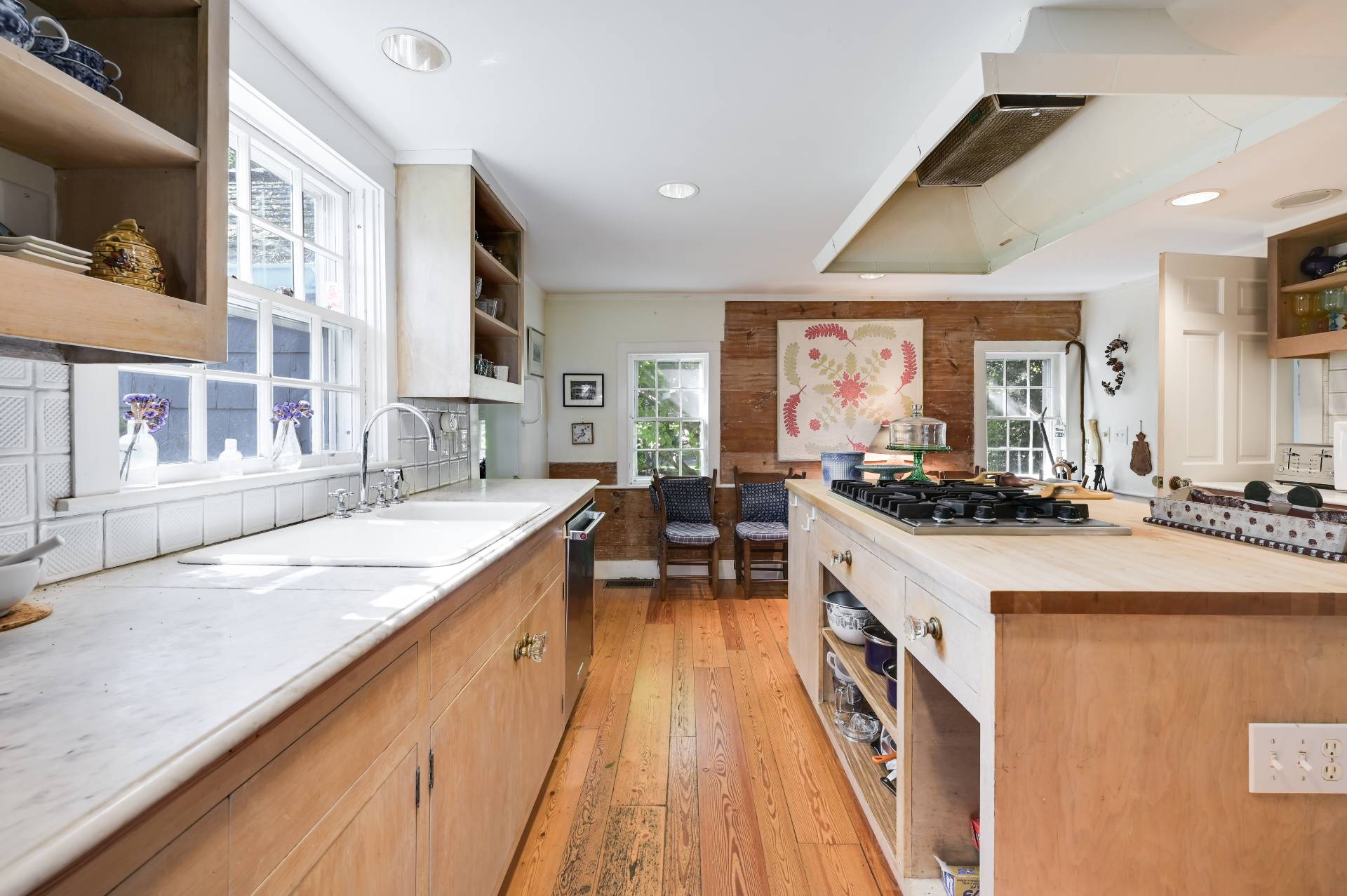 10 Ferry Road Sag Harbor, NY 11963 - Photo 27 of 41 a large kitchen with stainless steel appliances granite countertop a large counter top a stove and a sink