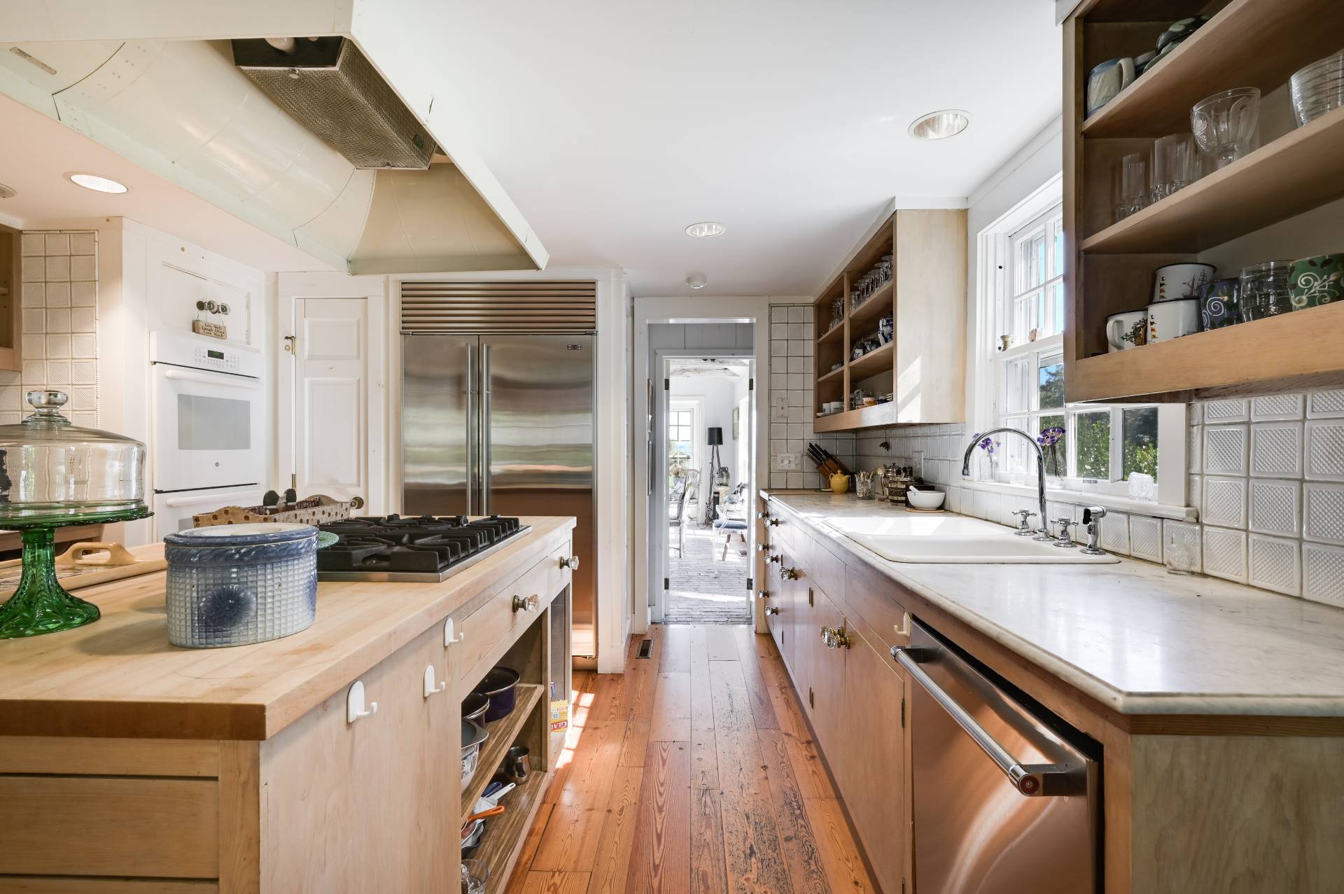 10 Ferry Road Sag Harbor, NY 11963 - Photo 28 of 41 a kitchen with a sink stove and cabinets