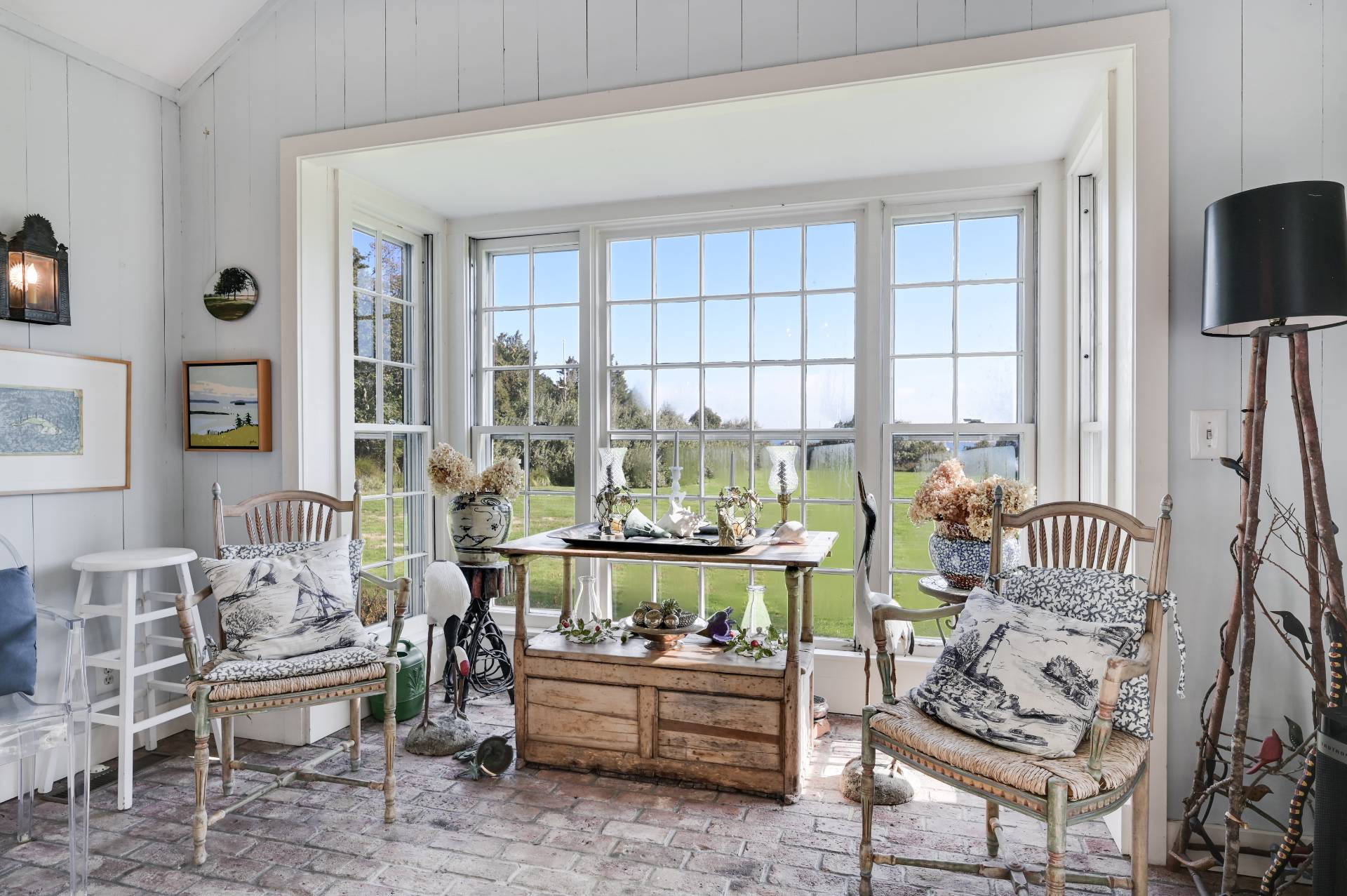 10 Ferry Road Sag Harbor, NY 11963 - Photo 31 of 41 a living room with furniture a fireplace and a flat screen tv