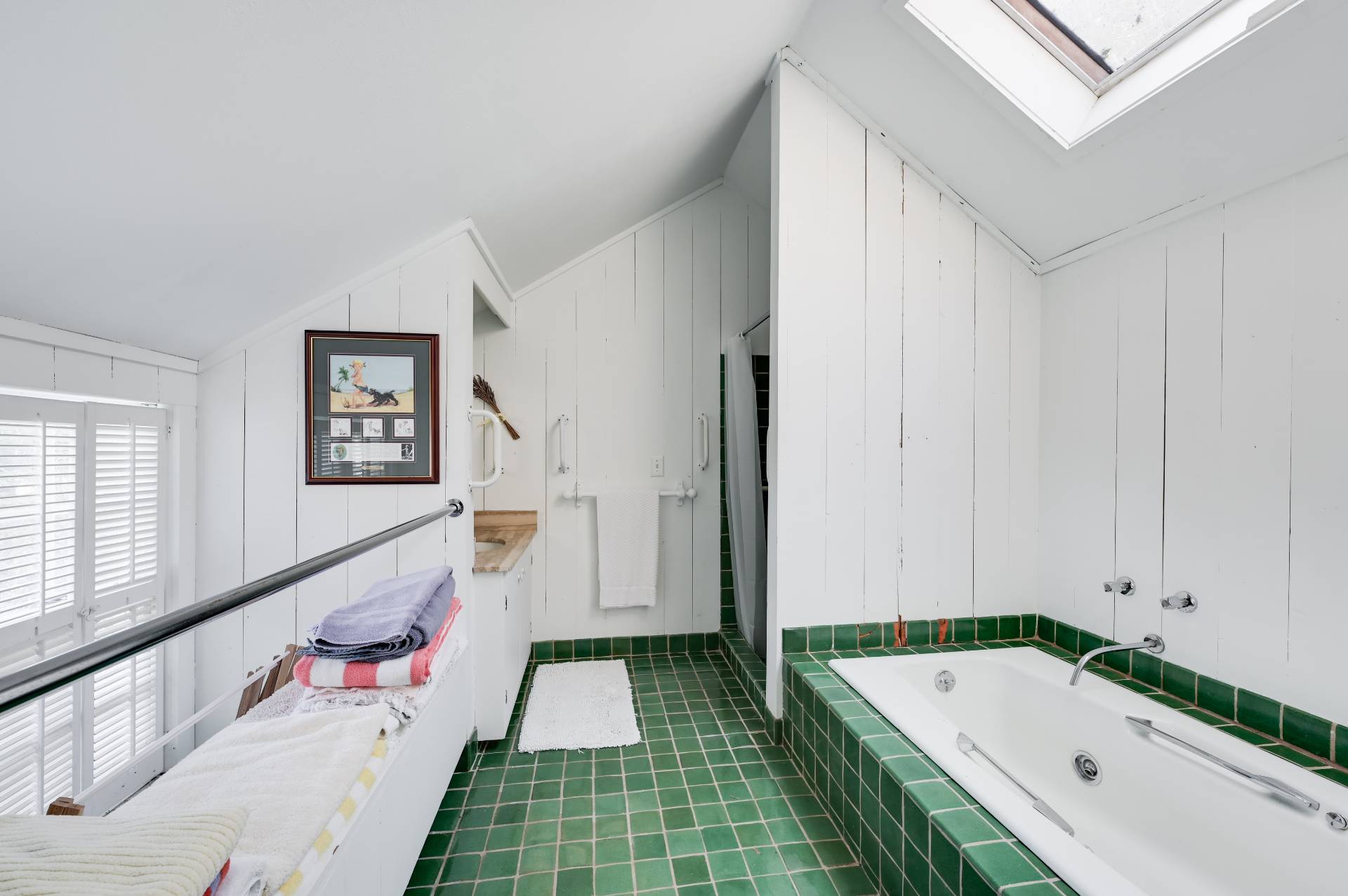 10 Ferry Road Sag Harbor, NY 11963 - Photo 36 of 41 a bathroom with a tub sink and mirror