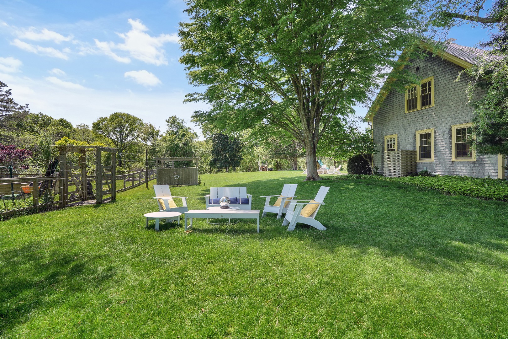 122 Old Farm Road Chilmark, MA 02535 - Photo 29 of 36 a view of a house with backyard sitting area and garden
