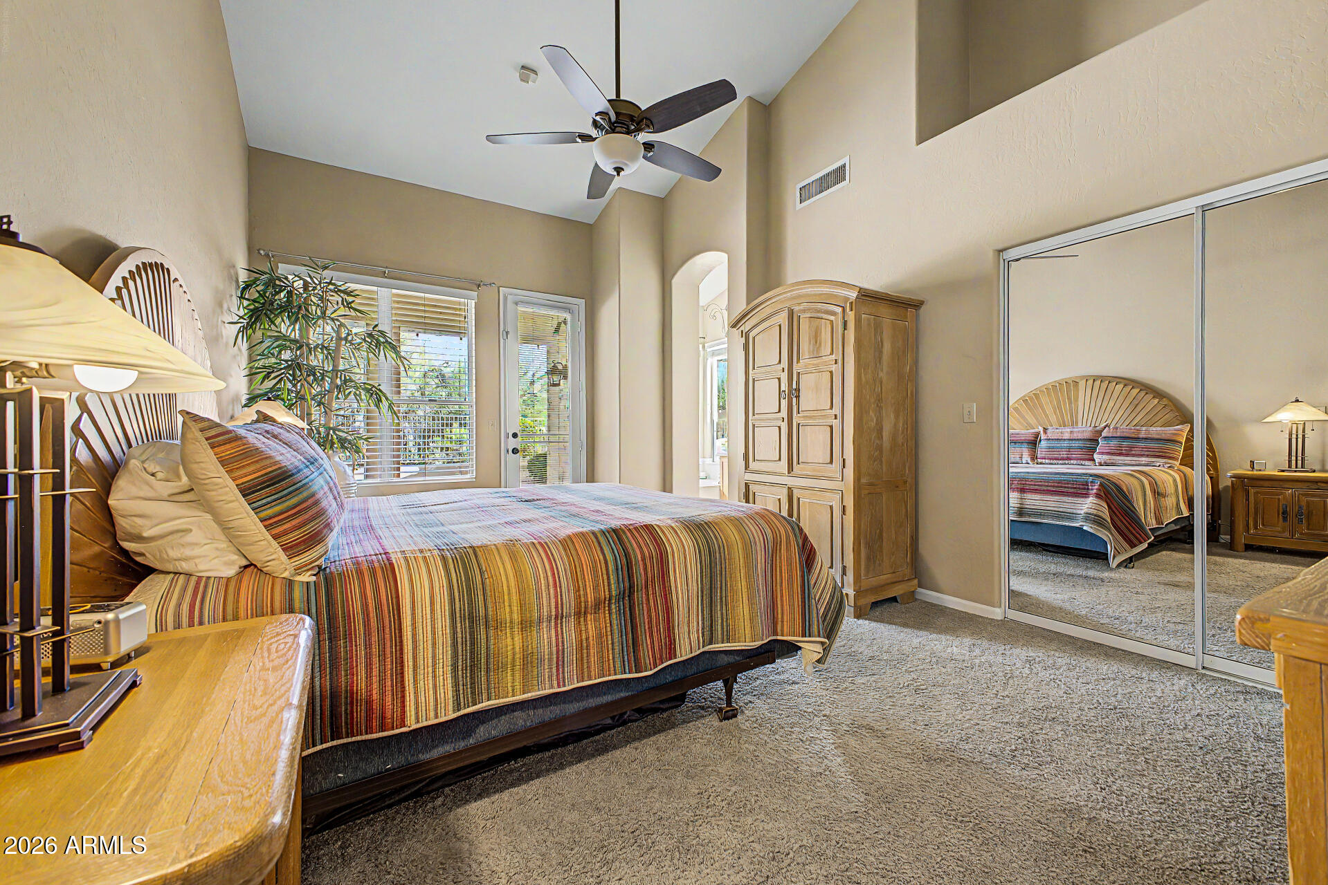 4309 East Rancho Caliente Drive Cave Creek, AZ 85331 - Photo 14 of 37 a spacious bedroom with a bed dresser and a window
