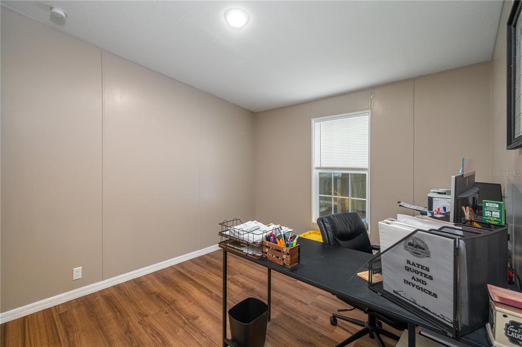 15079 Brahma Road Polk City, FL 33868 - Photo 20 of 40 a view of a workspace with furniture and a window