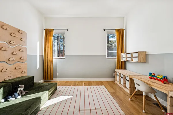 a bedroom with a bed and a dresser in it