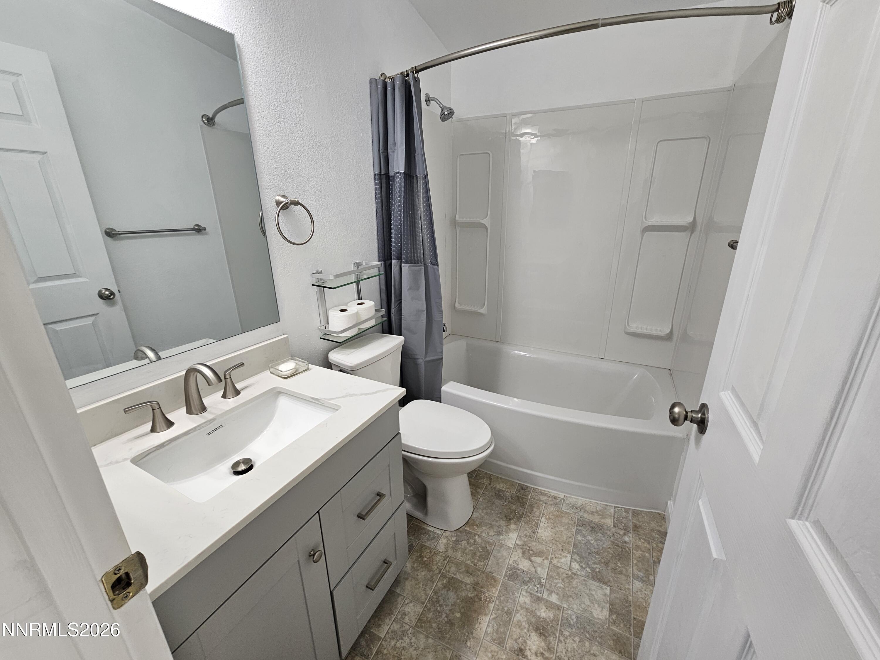 1125 Rancho Road Fernley, NV 89408 - Photo 25 of 47 a bathroom with a sink toilet tub and shower