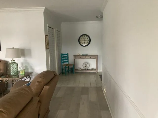 a living room with furniture and a mirror