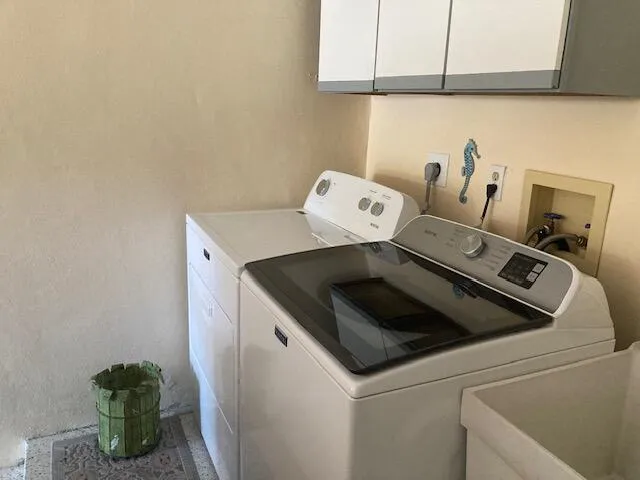 a utility room with dryer and washer