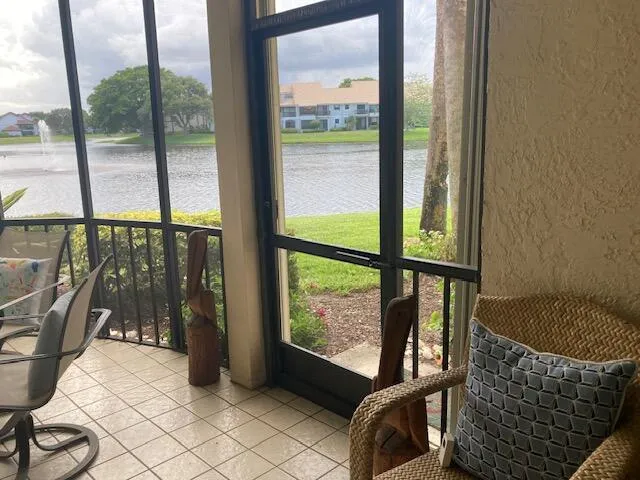 a balcony with table and chairs