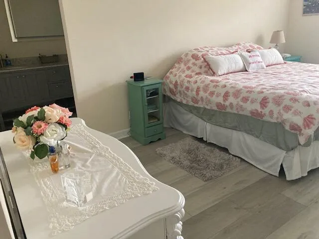 a bedroom with a bed and a dresser