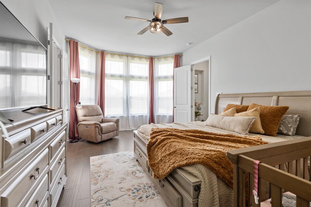 448 LeTara Ranch Drive Haslet, TX 76052 - Photo 11 of 32 a bed sitting in a bedroom next to a window