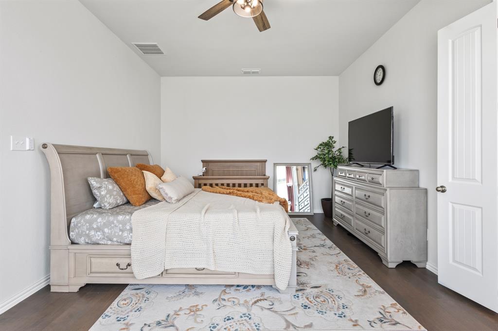 448 LeTara Ranch Drive Haslet, TX 76052 - Photo 12 of 32 a bedroom with a bed and flat screen tv