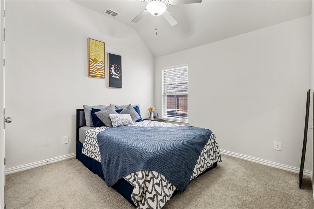 448 LeTara Ranch Drive Haslet, TX 76052 - Photo 20 of 32 a bedroom with a bed lamp and a window