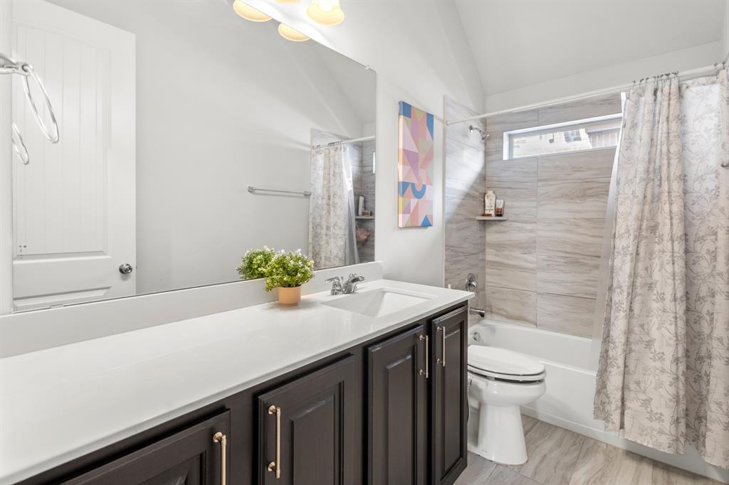 448 LeTara Ranch Drive Haslet, TX 76052 - Photo 21 of 32 a bathroom with a sink a toilet and shower