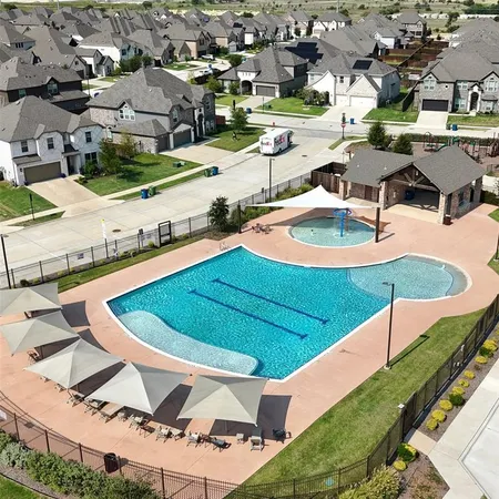 an aerial view of a house with swimming pool