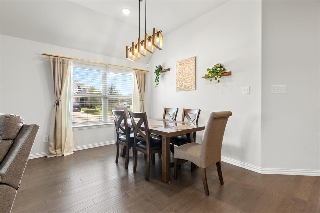 448 LeTara Ranch Drive Haslet, TX 76052 - Photo 9 of 32 a view of a dining room with furniture window and wooden floor
