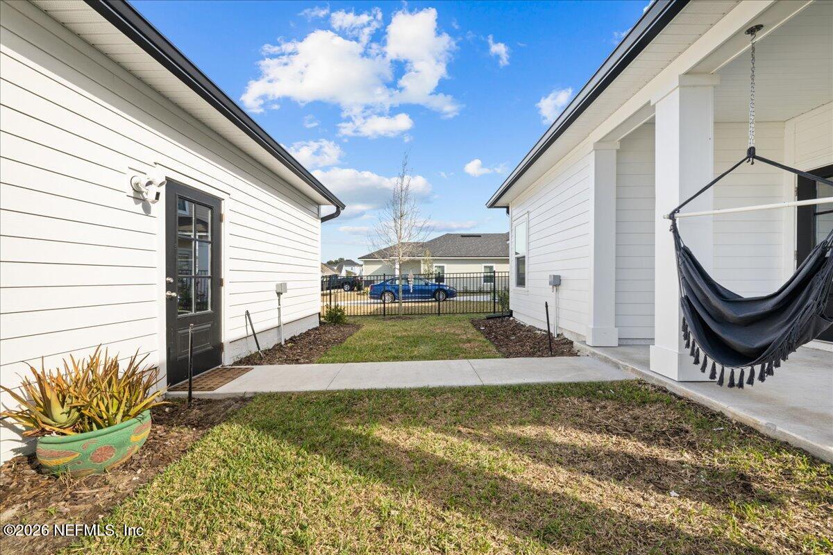 92 Patina Place St. Augustine, FL 32092 - Photo 23 of 26 a view of a backyard with a patio