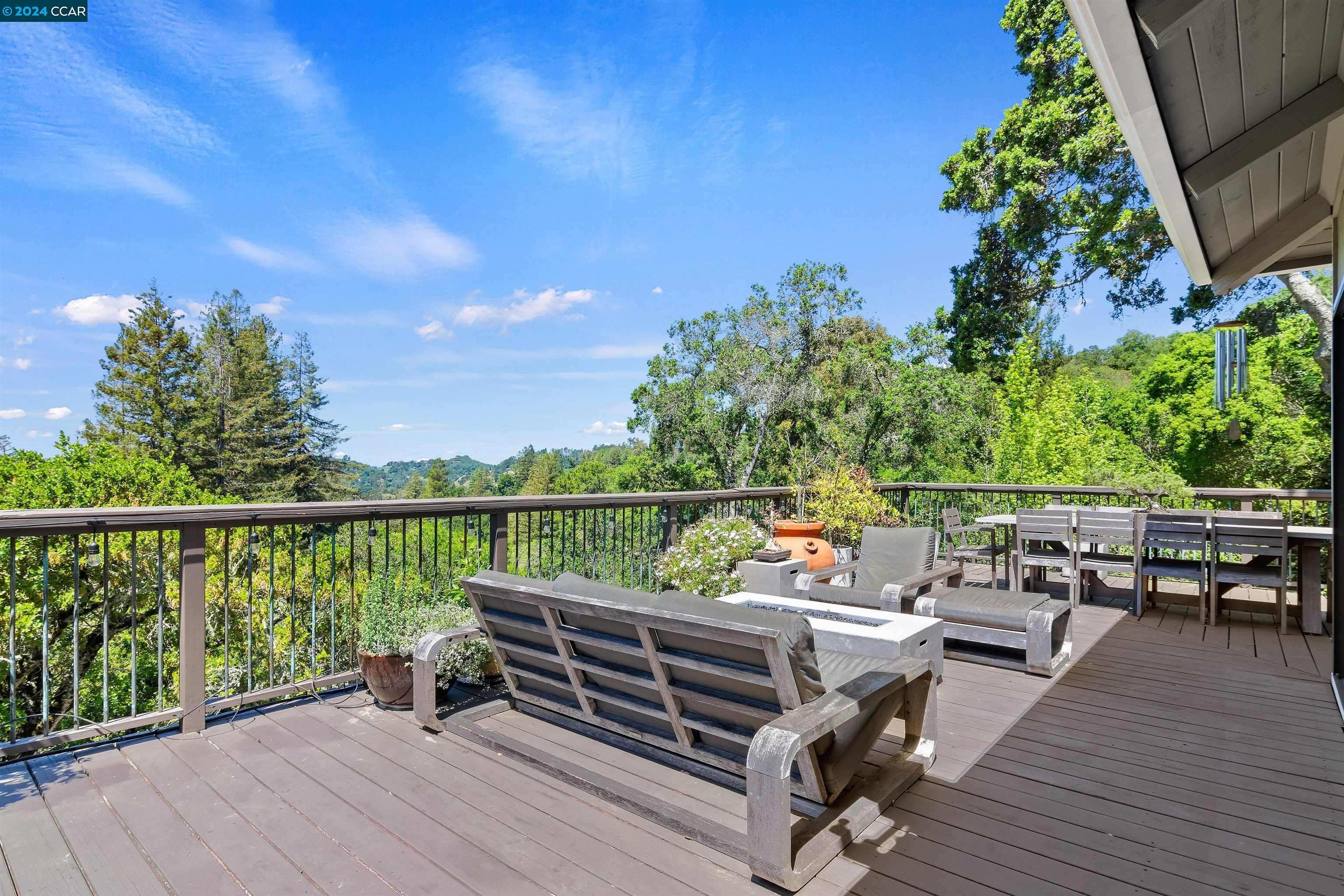 710 Miner Road Orinda, CA 94563 - Photo 1 of 1 a view of a balcony with wooden floor and outdoor seating