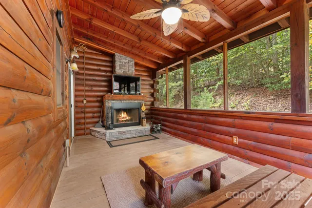 a room with pool table and windows