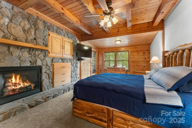 a bedroom with furniture and a fireplace