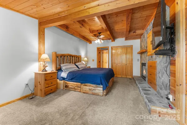 a spacious bedroom with a bed and a window