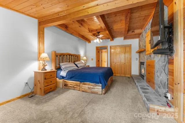 a spacious bedroom with a bed and a window