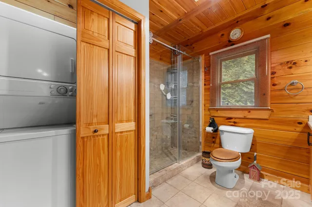 a bathroom with a toilet and shower