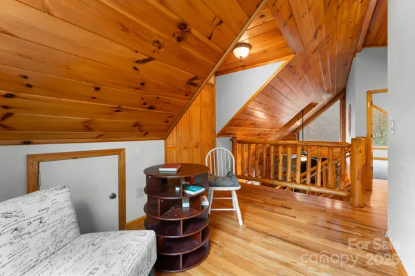 a bedroom with furniture and flat screen tv