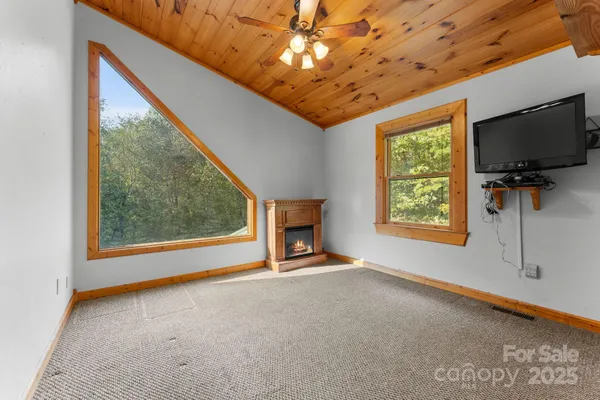 a view of an empty room with a fireplace
